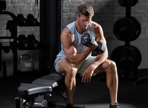 Man lifting weights in a gym setting
