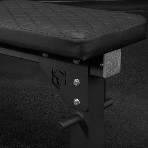 Black weight bench with quilted design on the seat pad, featuring a logo on the frame.