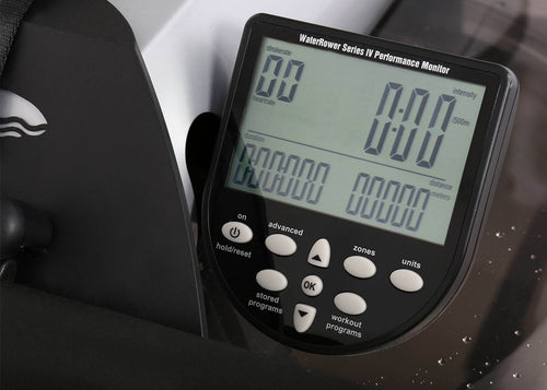 Digital performance monitor on a water rower with visible brand logo.