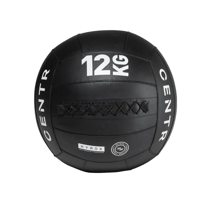 Black wall ball with '12KG' marking and 'CENTR' branding on a gray background