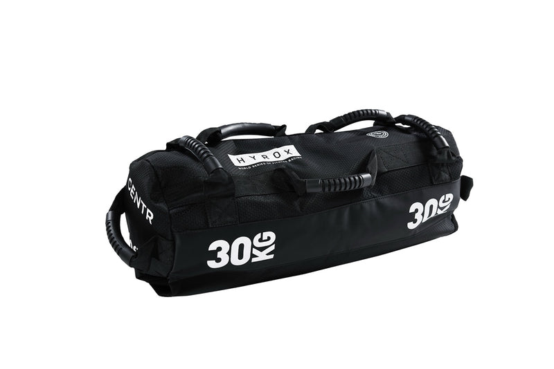 A black sandbag with '30kg' written on it, designed for fitness training.