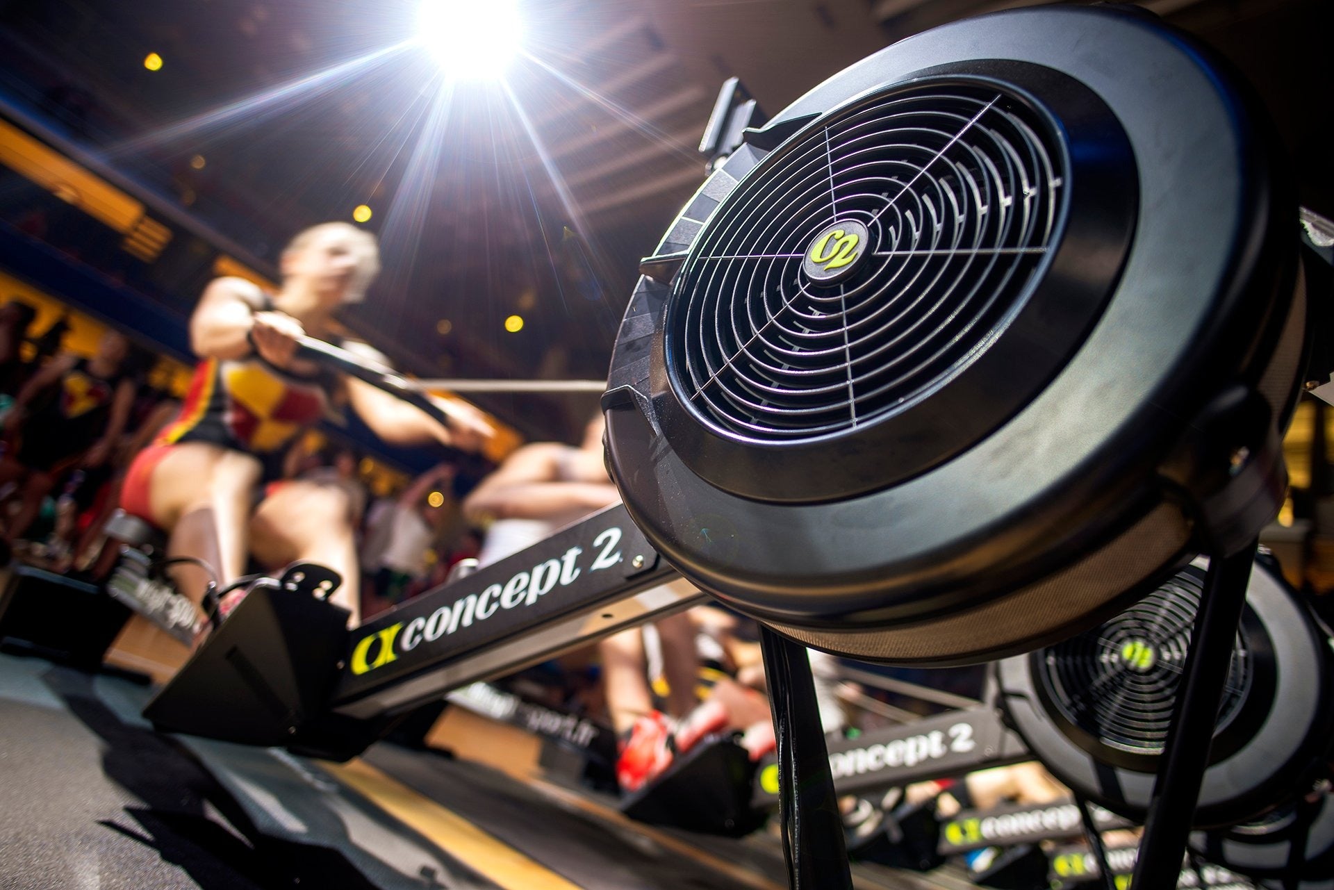 Close-up of a rowing machine with 'Concept 2' branding in a gym setting.