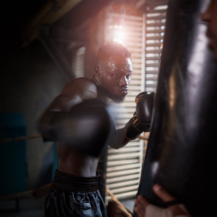 Boxer in training with a focus on technique and form.