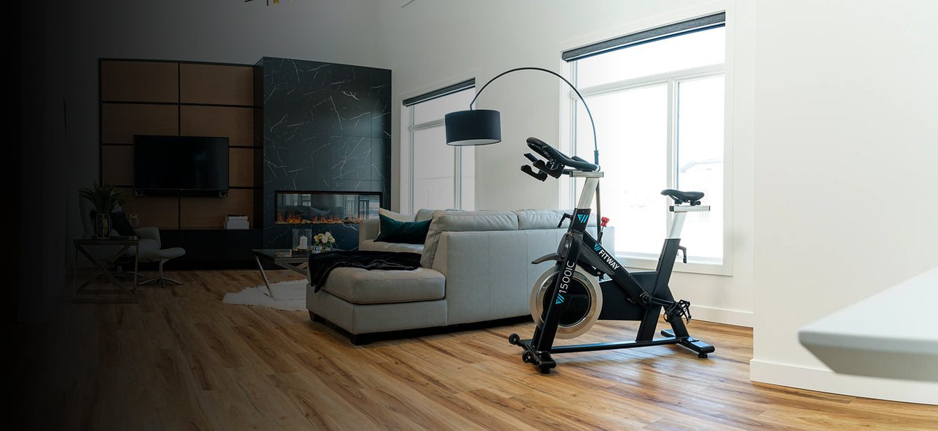 Modern living room with a home gym setup featuring a stationary bike.