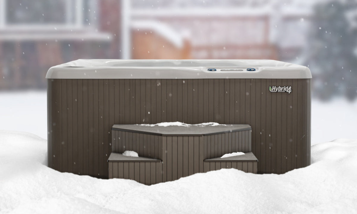 Hot tub in the snow with 'Hybrid4' branding
