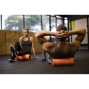 TriggerPoint Grid 1.0 Foam Roller - Orange in use | Fitness Experience