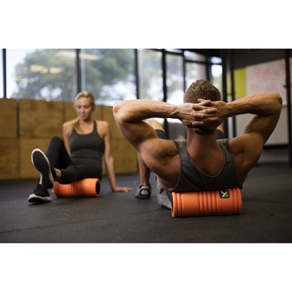 TriggerPoint Grid 1.0 Foam Roller - Orange in use | Fitness Experience